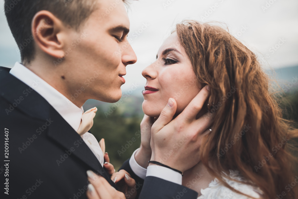 Sensual portrait of a young wedding couple. Outdoor Sensual portrait of a young wedding couple. Outdoor