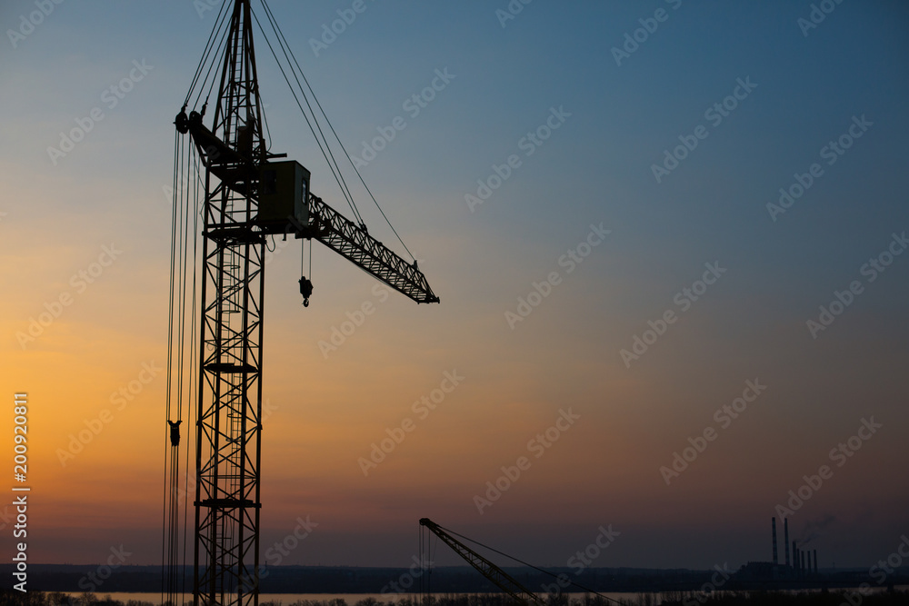 Construction crane at dawn