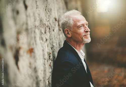 Portrait of handsome mature man, light effect photo