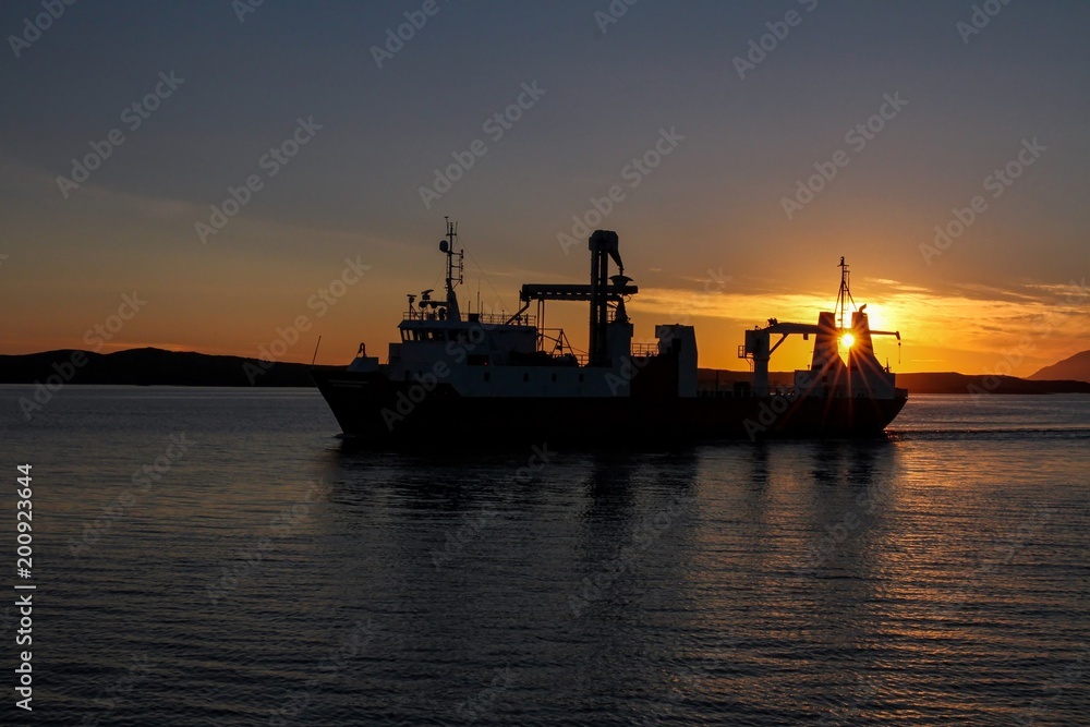 Ship in sunset Bronnoysund Northern Norway