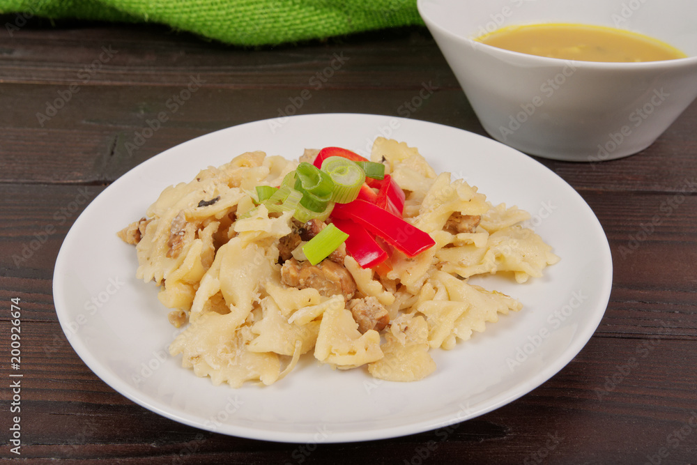 Wholemeal pasta baked with cabbage on a table Wholemeal pasta baked with cabbage on a table