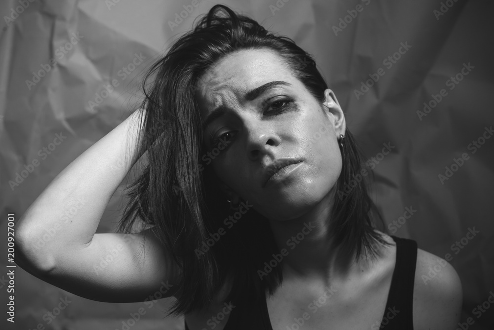 Depressed young woman. Studio portrait.