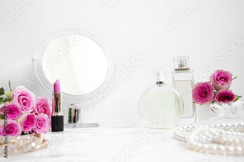 Canvas Print women's accessories on table in the bathroom with a mirror and cosmetics