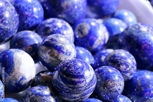 Cobalt blue lapis lazuli balls. Selected focus. Minerals exhibition. photo