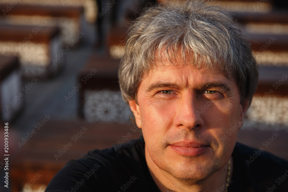 Portrait of Mature Handsome Man looking at camera. Serious adult man with grey hair. Senior man with gray hair. Portrait of Mature Handsome Man looking at camera. Serious adult man with grey hair. Senior man with gray hair.