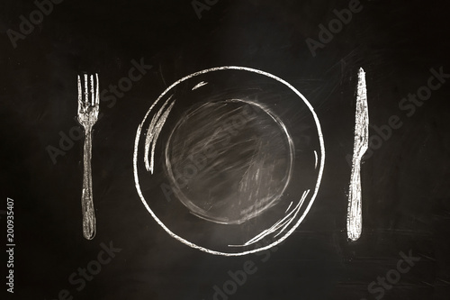 Menu restaurant on a plate with a fork on the side in retro style drawing with chalk on blackboard.