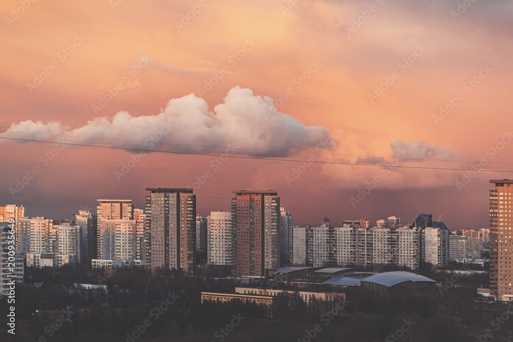 Panorama of high building town on sunset with colorful sky