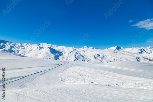 Alpine winter landscape of slopes and off piste skiing, in the highest French resort of Val Thorens, Les Trois Vallees