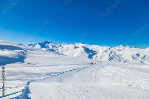 Alpine winter landscape of slopes and off piste skiing, in the highest French resort of Val Thorens, Les Trois Vallees © umike_foto
