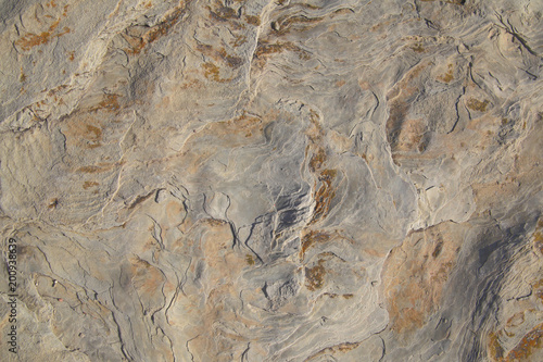 Close up of intricate texture of rock formation as background.