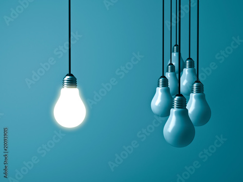 One hanging light bulb glowing and standing out from unlit bulbs on dark green pastel color background. 3D rendering.