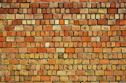 Weathered stained old brick wall background