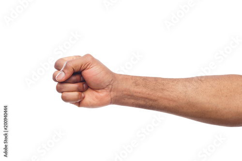 Fotografie Male black fist isolated on white background