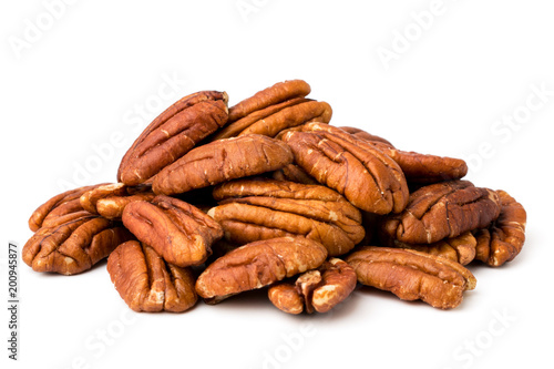 A bunch of peeled pecans on a white, isolated. photo