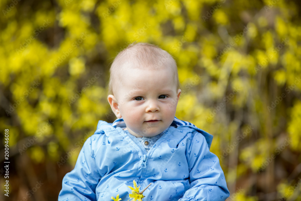 Adorable child, playing in the grass in park Adorable child, playing in the grass in park