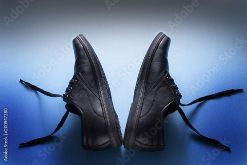 Blue fashion man's pair shoes on blue background