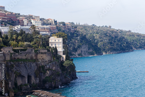 villas on a steep cliff near the sea in Sorrento in Amalfi coast, Italy