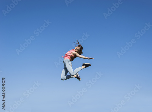 girl jumping on the sky background