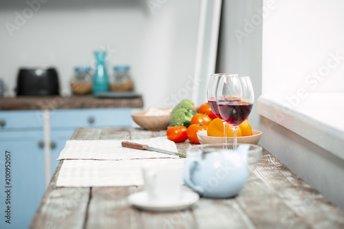 Alcoholic drink. Close up of a table with two wine glasses standing on it