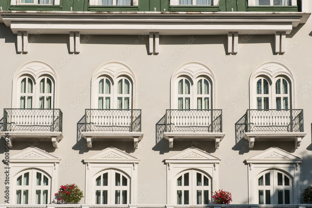 windows and balcony on beautiful facade 