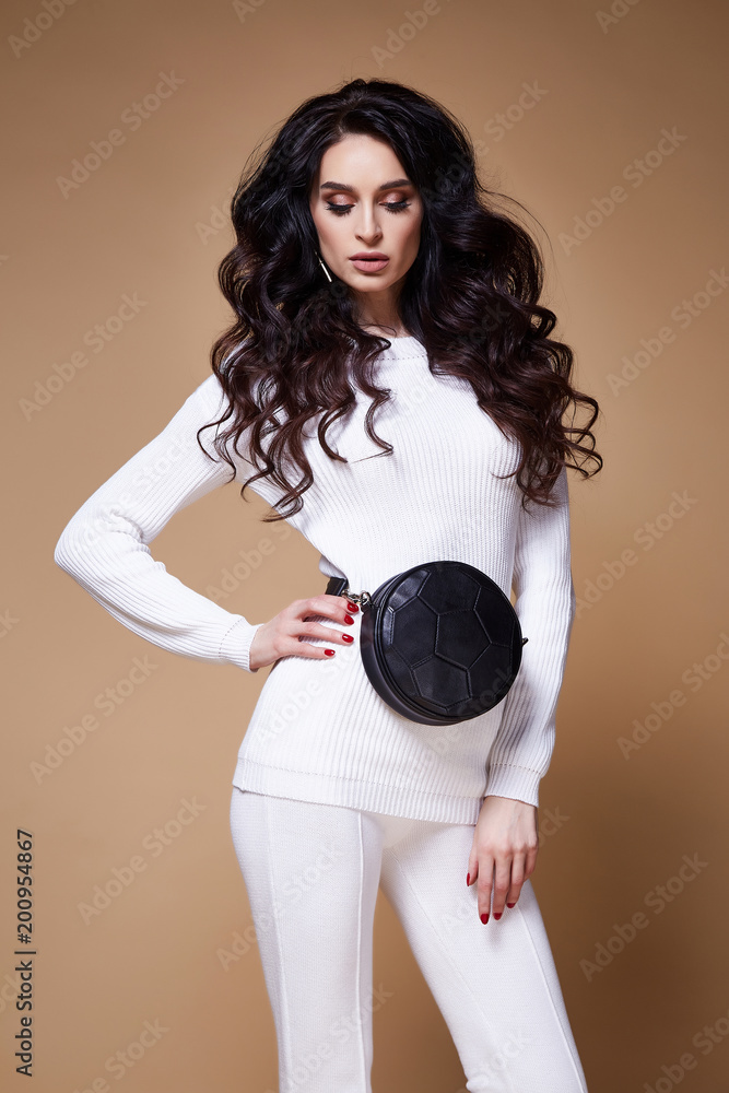 Fototapeta premium Sexy beautiful woman fashion glamour model brunette hair makeup wear knitted sweater green trousers clothes for every day casual party style jewelry date walk girlfriend skinny body shape studio.