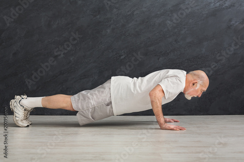 Senior man fitness workout, push ups or plank