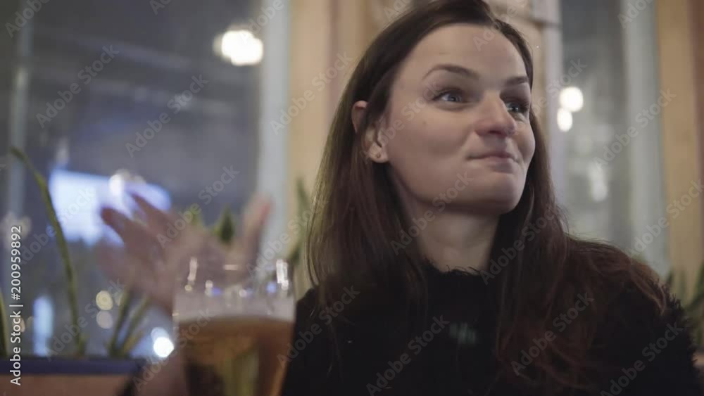 Closeup of Woman drinking Beer in a Cafe Closeup of Woman drinking Beer in a Cafe