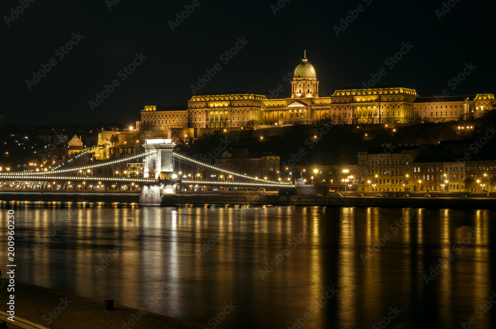 Chain Bridge with the Royal Palace in the background in Budapest at night