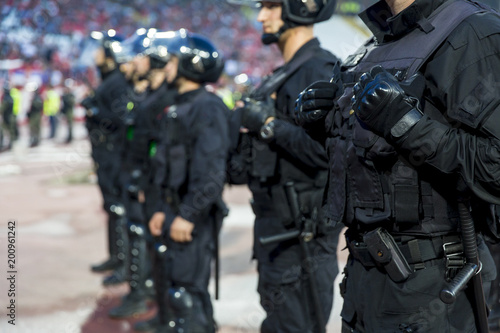 Tableau sur toile Special police unit at the stadium event secure a safe match