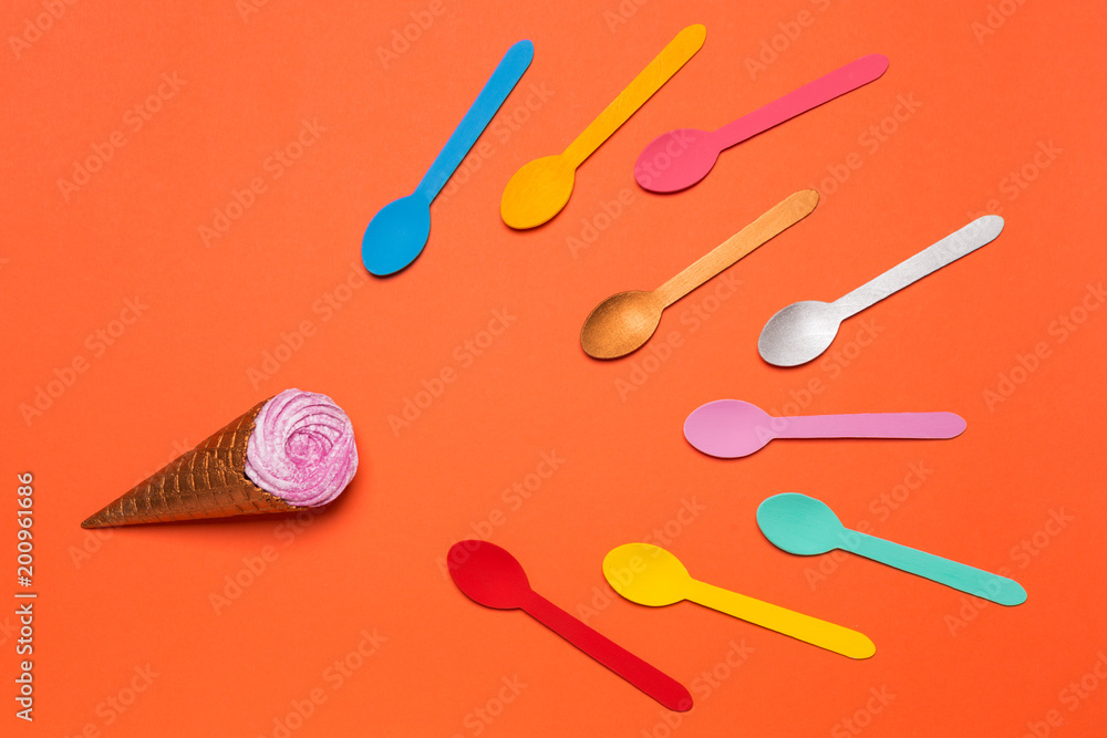 a horn with ice cream or with a cream and a lot of multicolored spoons aspire to ice cream a horn with ice cream or with a cream and a lot of multicolored spoons aspire to ice cream