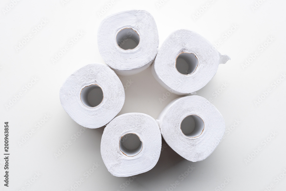 Directly above view of white recycled toilet paper rolls arranged on white background Directly above view of white recycled toilet paper rolls arranged on white background