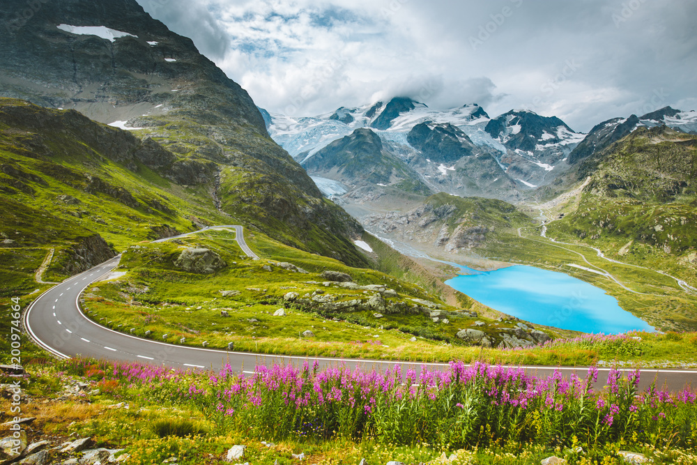 Alpine mountain scenery with country road in summer