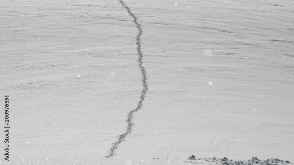 Trail of mountain climbers in snow at six thousand feet in Kyrgyzstan Trail of mountain climbers in snow at six thousand feet in Kyrgyzstan