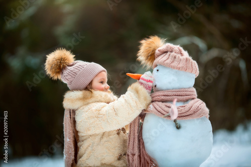 4065033 Little girl with snowman