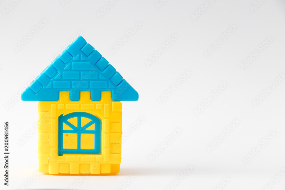Toy puzzle connect as house shape on white background (Concept for dream home or property loan investment) Toy puzzle connect as house shape on white background (Concept for dream home or property loan investment)