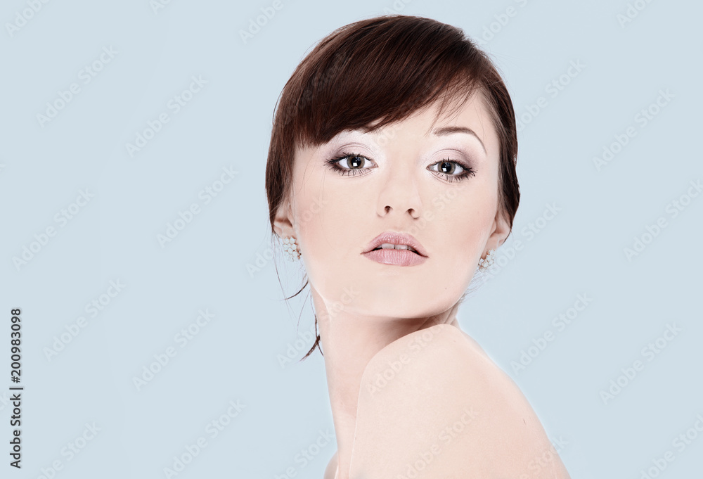 closeup.face of young woman on white background. closeup.face of young woman on white background.