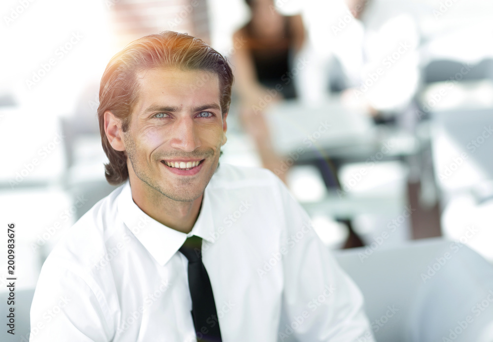young businessman on background of office young businessman on background of office