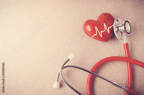 Fototapeta Naklejka Na Ścianę i Meble -  red heart with stethoscope, heart health,  health insurance,  world health day, world heart day concept