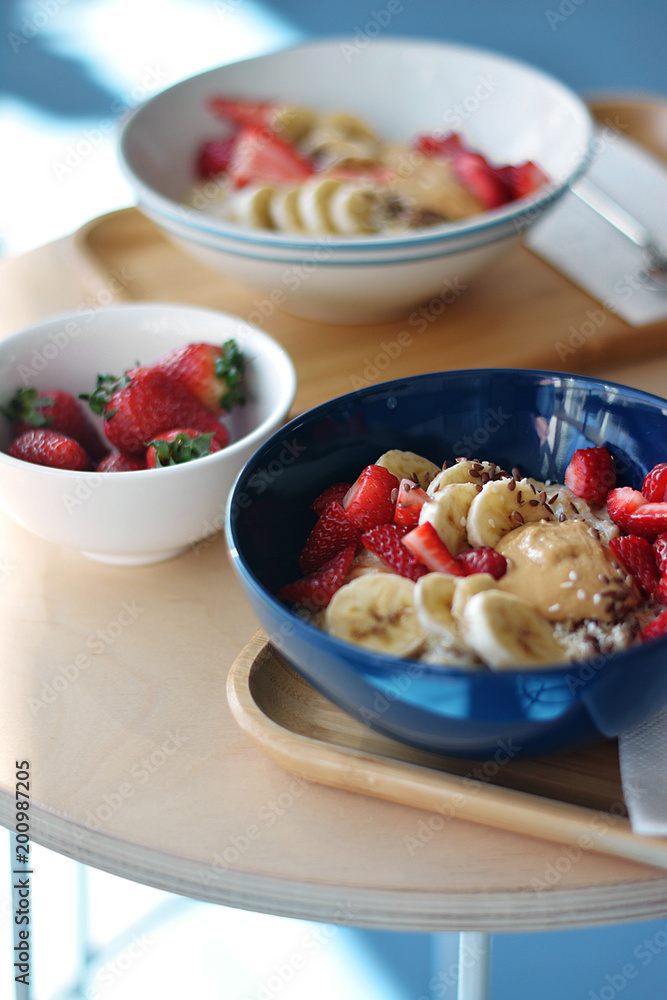 Oatmeal Breakfast with strawberry slices and banana slices, all sprinkled with bran Oatmeal Breakfast with strawberry slices and banana slices, all sprinkled with bran