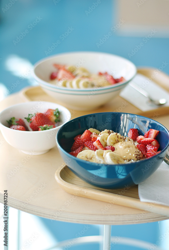Oatmeal Breakfast with strawberry slices and banana slices, all sprinkled with bran Oatmeal Breakfast with strawberry slices and banana slices, all sprinkled with bran