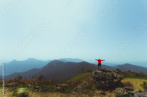 people stand on beautiful nature landscape mountain with blue sky background.