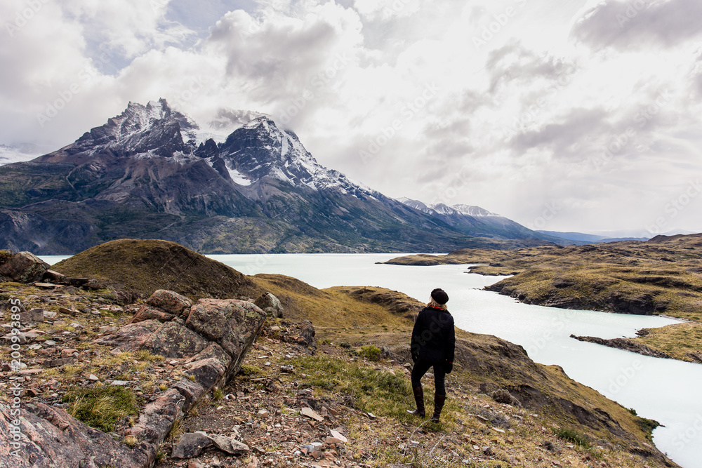 woman looking toward awesome view of Torres del Paine mountain range