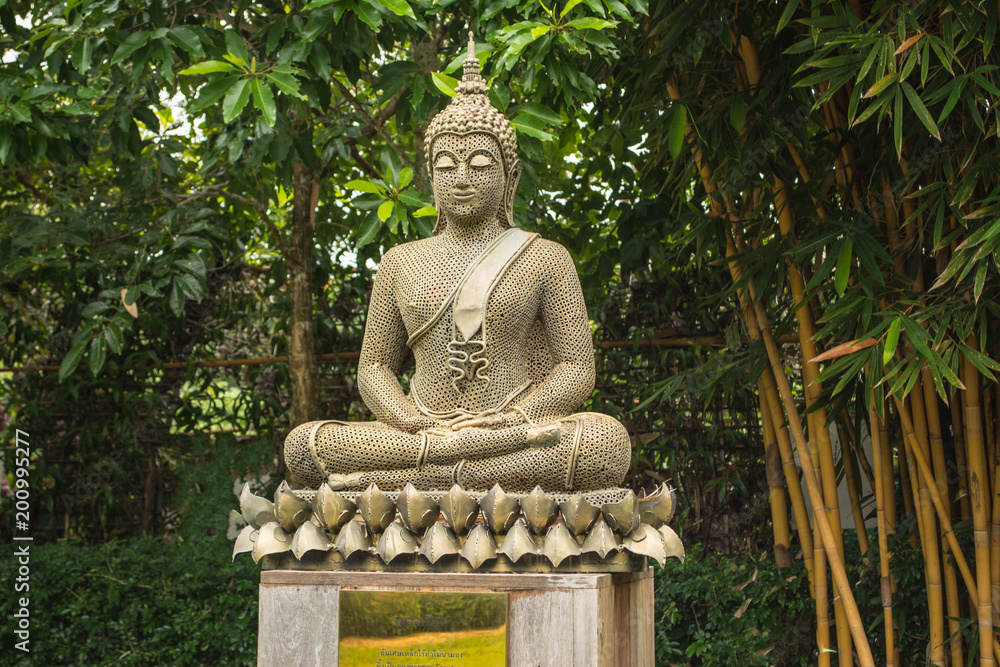 Artificial Buddha is in the garden. In the midst of the shady and cool in beautiful nature. Artificial Buddha is in the garden. In the midst of the shady and cool in beautiful nature.
