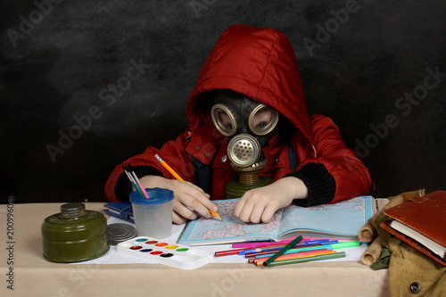 Schoolboy in a gas mask