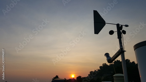Weathercock with sunset,Wind direction indicator.