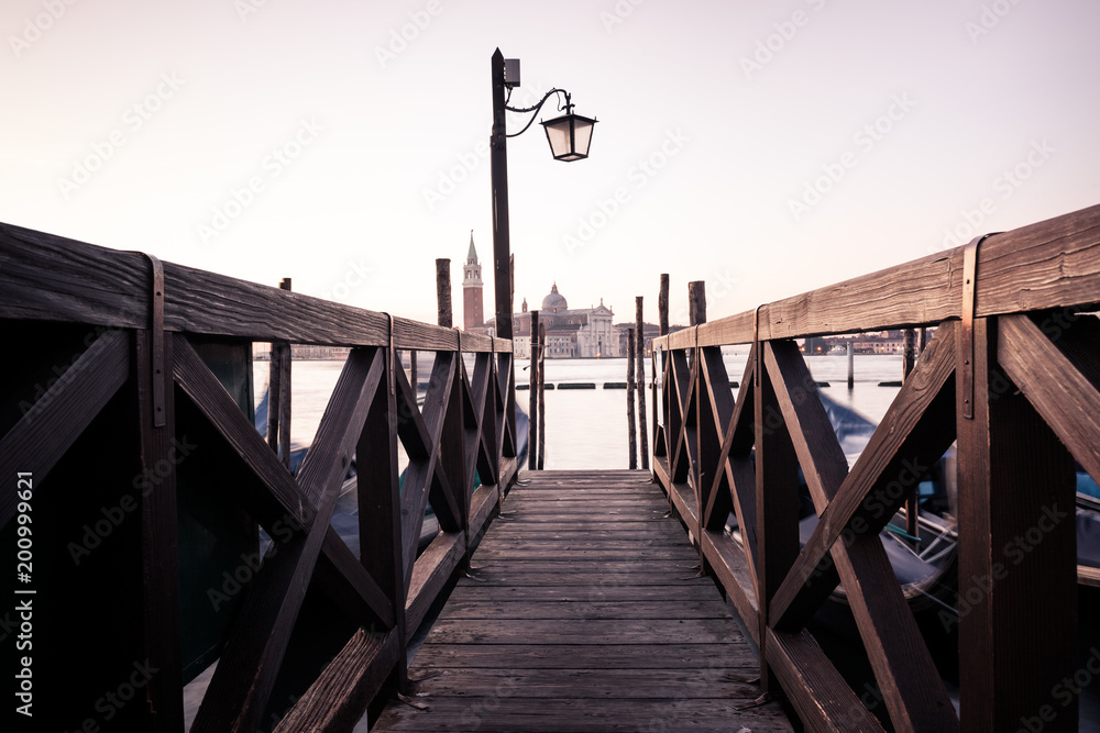 Fototapeta premium Venice classic view with famous gondolas at sunrise, Italy