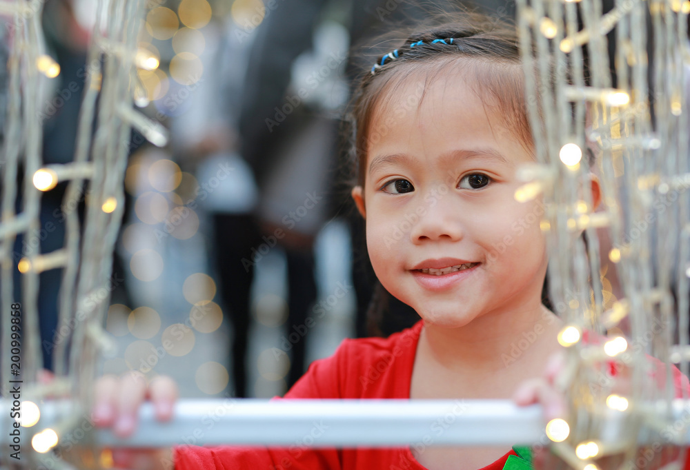 Portrait of Little Asian child girl with decoration light bulb in Merry Christmas and Happy New Year times. Portrait of Little Asian child girl with decoration light bulb in Merry Christmas and Happy New Year times.