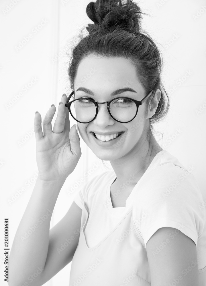 Portrait of young beautiful brunette woman girl model with nude makeup in colorful summer pink hipster clothes posing near wall. Going crazy Portrait of young beautiful brunette woman girl model with nude makeup in colorful summer pink hipster clothes posing near wall. Going crazy