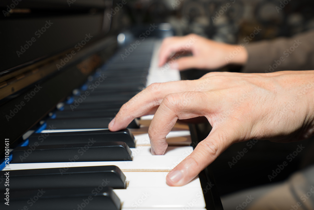 Obraz premium Musician playing piano her hands on piano keys, Playing classic piano