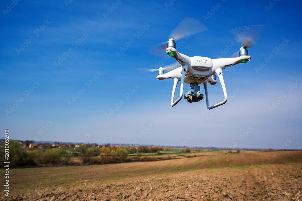 drone quad copter on green corn field drone quad copter on green corn field